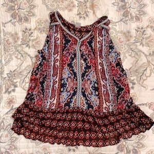 Blouse. Lots of patterns, red, blue, black.